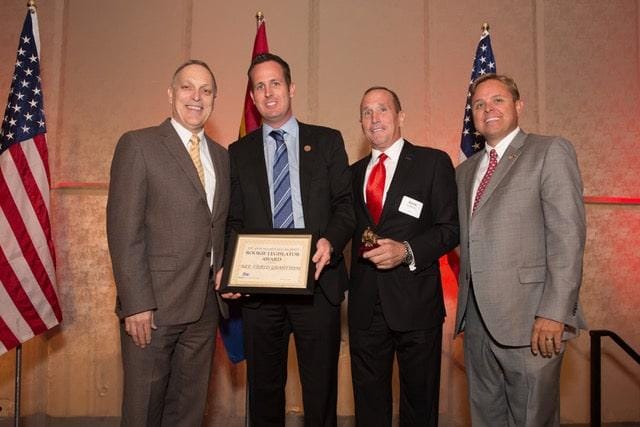 Congressman Andy Biggs, Kevin DeMenna and Arizona Republican Party Chairman Jonathan Lines presenting Representative Travis Grantham with the “Rookie Legislator Award” at the 2017 Republican Party Legislative Salute.